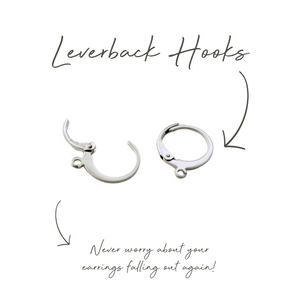 a picture of a pair of silver hoop earrings